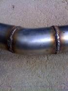 exhaust: shows 2 welds that i did on the MIG