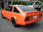 Orange 310 Coupe w/flares etc. 2